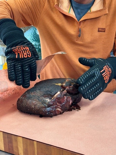 Pitmaster Ricky Wearing Grilling Gloves Wrapping Pork Butt in Butcher Paper