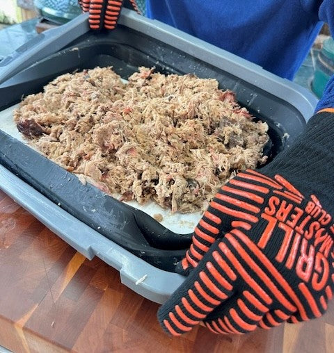 Grilling Gloves Used to Press down on a BBQ Prep Tub by Drip EZ